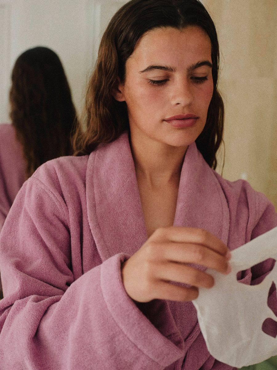A woman in a robe after a treatment